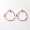 Fine Round Hoop Earrings in rose gold plated 925 sterling silver on white background
